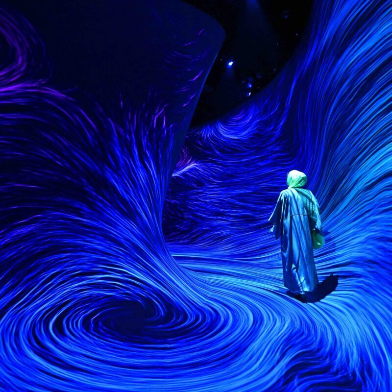 A woman visits the newly opened teamLab Phenomena, an immersive art experience museum newly opened in Abu Dhabi’s Saadiyat Cultural District. (Giuseppe Cacace /AFP via Getty Images)