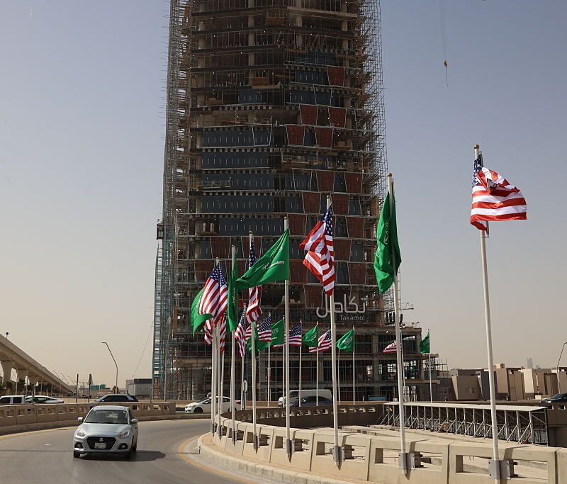 Traffic flows past Saudi and U.S. flags on a main road in Riyadh on Monday, hours before U.S. President Donald Trump is due to arrive in the kingdom. (Fayez Nureldine /AFP via Getty Images)