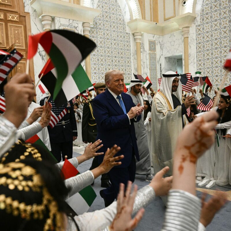 U.S. President Donald Trump and UAE President Sheikh Mohamed bin Zayed are greeted by Children waving Emirati and U.S. flags on arrival at Qasr Al-Watan palace in Abu Dhabi on Thursday evening. (Brendan Smialowski/AFP via Getty Images)