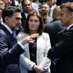 Yasir Al-Rumayyan, Governor of Saudi Arabia’s Public Investment Fund and Chairman of the FII Institute (left), meets with French President Emmanuel Macron following the FII Priority Europe Summit in the Albanian capital of Tirana on Saturday. (Ludovic Marin / AFP via Getty Images)