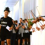 French basketballer Matthew Strazel, point guard for AS Monaco, is greeted by traditional Emirati dancers on arrival at the Hilton on Abu Dhabi’s Yas Island, where the Turkish Airlines EuroLeague Final Four will take place this weekend. (Luca Sgamellotti/Euroleague Basketball via Getty Images)