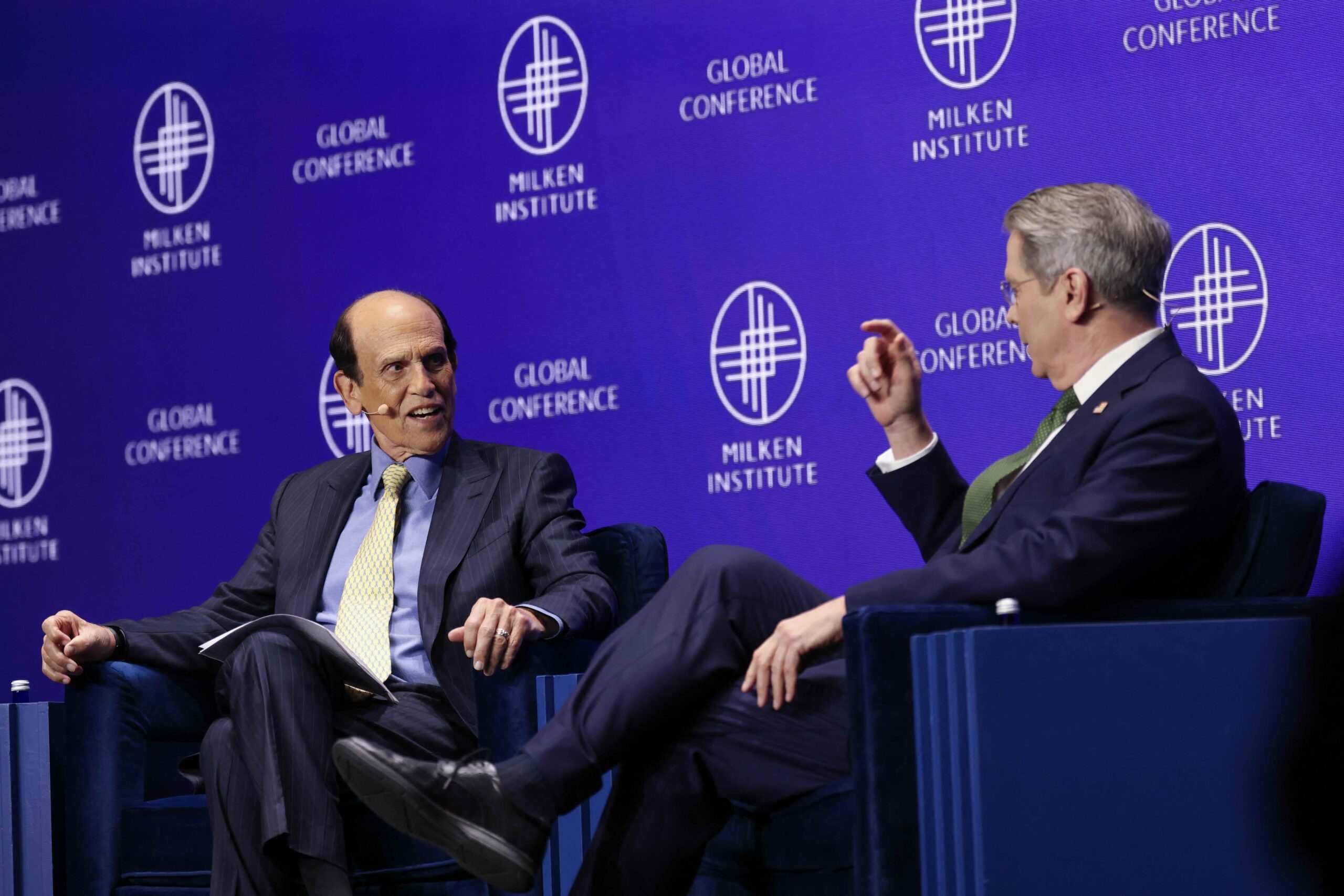 U.S. Secretary of the Treasury Scott Bessent and Michael Milken, Chairman of the Milken Institute, speak at the 28th annual Milken Institute Global Conference at the Beverly Hilton in Beverly Hills, California on Monday. (Patrick T. Fallon / AFP via Getty Images)